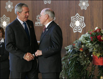 President George W. Bush is welcomed to the Asian-Pacific Economic Cooperation summit in Sydney by Australia’s Prime Minister John Howard Saturday, Sept. 8, 2007, at the Sydney Opera House.