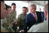 President George W. Bush talks with a member of the Australian Defense Force during a luncheon at the Royal Australia Navy Heritage Centre Wednesday, Sept. 5, 2007, on Garden Island in Sydney Harbor.