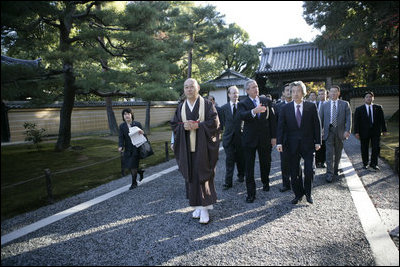 President George W. Bush and Japan’s Prime Minister Junichiro Koizumi join the Reverend Raitei Arima, Chief Priest of the Golden Pavilion Kinkakuji Temple in Kyoto, Japan, Wednesday, Nov. 16, 2005.