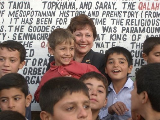 Agriculture Secretary Ann M. Veneman with children in Iraq.