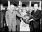  Photograph of President Truman receiving a Thanksgiving turkey from members of the Poultry and Egg National Board and other representatives of the turkey industry, outside the White House.