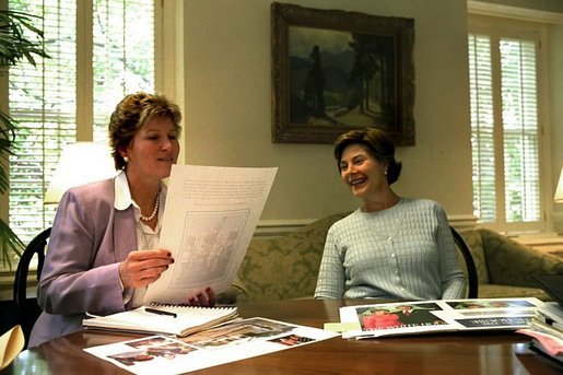Karen Hughes and Laura Bush discuss publication layouts June 28, 2002. White House photo by Susan Sterner.