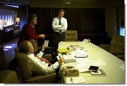 President George W. Bush meets with Karen Hughes and Karl Rove in the conference room aboard Air Force One Nov. 5, 2002. White House photo by Eric Draper.