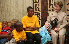 Mrs. Laura Bush joins a discussion with orphans and caretakers at the WAMA Foundation Sunday, Fab. 17, 2008 in Dar es Salaam, Tanzania, during a meeting to launch the National Plan of Action for Orphans and Vulnerable Children. White House photo by Shealah Craighead