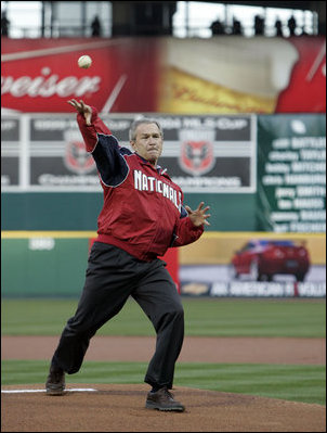 President George W. Bush throws out the ceremonial first pitch for the Washington Nationals Thursday, April 14, 2005, at RFK Stadium in Washington D.C.  The President's appearance was the highlight of the celebration that marked the return of major league baseball to the nation's capitol.