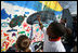 Kids paint a large mural of an ocean scene at the White House Easter Egg Roll Monday, Mar. 24, 2008 on the South Lawn of the White House. The theme for the 2008 Easter Egg Roll is Ocean Conservation. The kids were able to learn how to keep our oceans clean and healthy for fish and other ocean life.