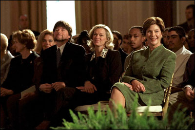 Hosting the Mark Twain Symposium, Laura Bush sits with Patricia Rowland and documentary filmmaker Ken Burns in the East Room Nov. 29, 2001.