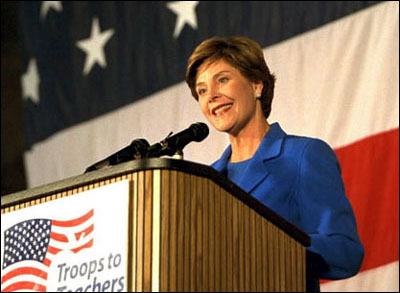 Laura Bush speaks during the <EM>Troops to Teachers</EM> rally at Wright Patterson Air Force Base in Dayton, Ohio, Oct. 16, 2002. White House photo by Susan Sterner.