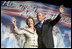 President George W. Bush and Laura Bush wave to the crowd of military families, Wednesday, Aug. 24, 2005 at the Idaho Center Arena in Nampa, Idaho, following the President's speech honoring the service of National Guard and Reserve forces serving in Afghanistan and Iraq.