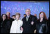 President George W. Bush and Laura Bush join holiday entertainers Thursday evening, Dec. 1, 2005, on stage during the Pageant of Peace and lighting of the National Christmas Tree festivities on the Ellipse in Washington.