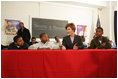 Laura Bush addresses young boys participating in the Passport to Manhood program taught by male staff members at the Germantown Boys and Girls Club Tuesday, Feb. 3, 2005 in Philadelphia. Passport to Manhood promotes and teaches responsibility through a series of classes for male club members ages 11-14.