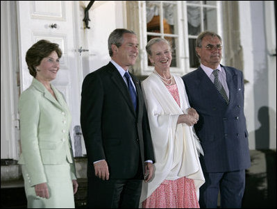 President George W. Bush and Mrs Bush join Her Majesty Queen Margrethe II and His Royal Highness The Prince Henrik of Denmark after arriving at the Fredensborg Palace, Tuesday, July 5, 2005.