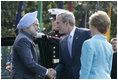 President George W. Bush and Laura Bush welcome India's Prime Minister Dr. Manmohan Singh upon his arrival to the White House, Monday, July 18, 2005.