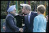 President George W. Bush and Laura Bush welcome India's Prime Minister Dr. Manmohan Singh upon his arrival to the White House, Monday, July 18, 2005.