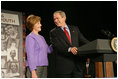 President George W. Bush and Laura Bush laugh as he introduces her during her remarks on Helping America's Youth at the Community College of Allegheny County in Pittsburgh Monday, March 7, 2005.