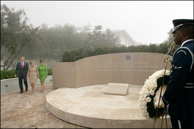 President George W. Bush, Nancy Reagan and Laura Bush approach the memorial of President Ronald Reagan at the Ronald Reagan Presidential Library in Simi Valley, Calif., where they participated in a wreath laying ceremony, Friday, Oct. 21, 2005.