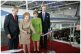 President George W. Bush and Laura Bush join Nancy Reagan, Friday, Oct. 21, 2005, as she cuts the ribbon to officially open the Air Force One Pavilion at the Ronald Reagan Library in Simi Valley, Calif., featuring the Boeing 707 aircraft that served President Ronald Reagan and six other presidents. Fred Ryan Jr. of the Ronald Reagan Presidential Foundation is seen at right.