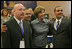 Laura Bush poses for photos with Homeboy Industries representatives, Gustavo Mojica, Herbert Corleto and Gabriel Hinojos, Thursday, Oct. 27, 2005 at Howard University in Washington, at the White House Conference on Helping America's Youth.