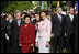 Mrs. Laura Bush stands with Liu Yongqing, the wife of Chinese President Hu Jintao, during the South Lawn Arrival Ceremony, Thursday, April 20, 2006.