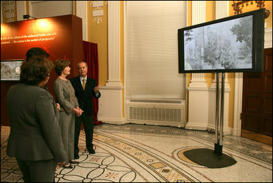 Mrs. Laura Bush is shown a video presentation on the preservation and study of Leonardo Da Vinci's drawing and painting of The Adoration of the Magi, Thursday, Dec. 7, 2006 at the Library of Congress in Washington, D.C., by professor Paolo Galluzzi, the director of the National Museum of History of Science in Florence, Italy.