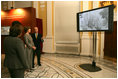 Mrs. Laura Bush is shown a video presentation on the preservation and study of Leonardo Da Vinci's drawing and painting of The Adoration of the Magi, Thursday, Dec. 7, 2006 at the Library of Congress in Washington, D.C., by professor Paolo Galluzzi, the director of the National Museum of History of Science in Florence, Italy.