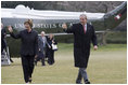 President George W. Bush and Laura Bush arrive on the South lawn at the White House returning from delivering remarks on the 2006 agenda in Nashville, Tennessee, Wednesday, Feb. 1, 2006.