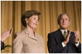 Mrs. Laura Bush acknowledges applause from President George W. Bush and the audience Thursday, Feb. 2, 2006, as she's introduced during the National Prayer Breakfast at the Hilton Washington Hotel.