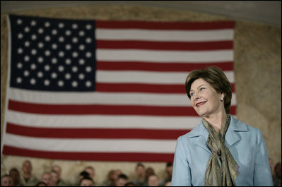 Mrs. Laura Bush appears before an audience of U.S. and Coalition troops, Wednesday, March 1, 2006, during a visit to Bagram Air Base in Afghanistan, where President George W. Bush thanked the troops for their service in defense of freedom.