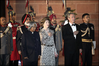 President and Mrs. Bush stand with India's President A.P.J. Abdul Kalam during the playing of their respective national anthems Thursday, March 2, 2006, at the State Dinner in New Delhi.