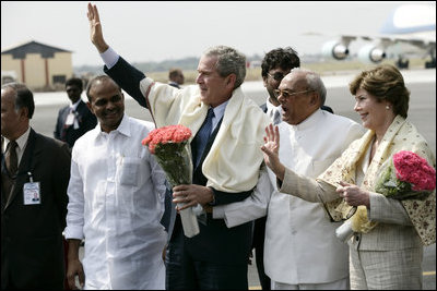 President George W. Bush and Laura Bush wave as they prepare to depart Hyderabad Airport Landing Zone for a return flight to New Delhi.