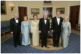 President George W. Bush, Laura Bush, Vice President Dick Cheney and Lynne Cheney stand with Australian Prime Minister John Howard and his wife Mrs. Janette Howard in the Blue Room for a photograph during the official dinner Tuesday, May 16, 2006.