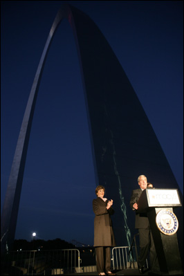 Mrs. Laura Bush applauds Chairman and CEO William McNamara of Macy's Midwest, as he delivers welcoming remarks during the Arch Lighting for Breast Cancer Awareness event in Thursday, Oct. 12, 2006, in St. Louis. The Gateway Arch was illuminated in pink in honor of Breast Cancer Awareness Month.