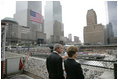 President George W. Bush and Laura Bush look over the World Trade Center site Sunday, September 10, 2006, during a visit to Ground Zero in New York City to mark the fifth anniversary of the September 11th terrorist attacks.