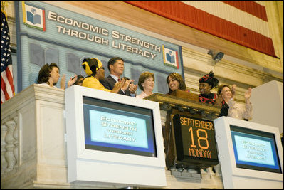 Mrs. Laura Bush is applauded as she stands over the New York Stock Exchange Monday, Sept. 18, 2006, where she visited to highlight literacy's role in extending the benefits of free enterprise to individuals around the world.