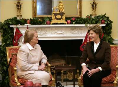 Mrs. Laura Bush enjoys a visit Tuesday morning, Dec. 11, 2007, with Mrs. Clio Napolitano, wife of President Giorgio Napolitano of Italy, during their visit to the White House.