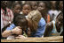 Ms. Jenna Bush hugs a little girl who danced during a performance Tuesday, June 26, 2007, by musician Youssou N'Dour for the children at Grand Medine Primary School in Dakar, Senegal.