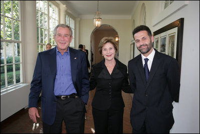 President George W. Bush and Mrs. Laura Bush welcome author Khaled Hosseini to the White House for a screening Sunday, Sept. 16, 2007, of the film adaptation of Hosseini's novel, "The Kite Runner," a fictional story of the friendship between Amir, a privileged boy, and Hassan, the son of his father's servant, in Afghanistan during the last days of the monarchy through the rule of the Taliban. Guests at the screening included: Vice President Dick Cheney; Secretary of Defense Robert Gates; Chairman of the Joint Chiefs of Staff General Peter Pace; National Security Advisor Stephen Hadley; Ambassador Said T. Jawad of Afghanistan; former U.S. Ambassador to Afghanistan, now U.S. Ambassador to the United Nations Zalmay Khalilzad; former U.S. Ambassador to Afghanistan Ronald E. Neumann; and President of the American University in Afghanistan Tom Stauffer.