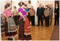 Mrs. Laura Bush stands with Sochi Mayor Viktor Kolodyazhny as they listen to the Russian singing group "Lubo," during a visit Sunday, April 6, 2008, to the Sochi Art Museum. With them at left is Mrs. Svetlana Ushakova, spouse of Yury Ushakov, Russian Ambassador to the United States.