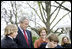 President George W. Bush and Mrs. Laura Bush watch kids shovel dirt to help plant a Scarlet Oak tree Wednesday, April 9, 2008, at the commemorative tree planting on the North Lawn of the White House. The Scarlet Oak replaces a tree planted by President Benjamin Harrison that fell on October, 25, 2007.