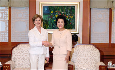 Mrs. Laura Bush meets with Mrs. Kim Yoon-ok, wife of the President of the Republic of Korea, during a coffee in Seoul on August 6, 2008.