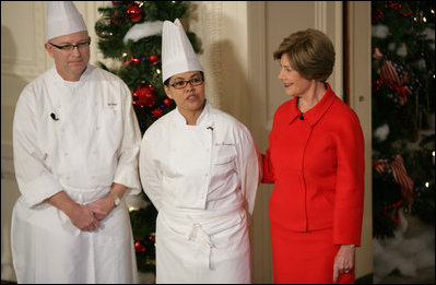 Mrs. Laura Bush is joined by White House Executive Chef Cris Comerford, and Bill Yosses, White House Pastry Chef, during the 2008 White House Holiday Press Preview Wednesday, Dec. 3., 2008, in the East Room. Said Mrs. Bush, "This is a special holiday for us... our final in the White House. Thank you to the American people for their friendship, prayers, and support. The President and I wish you and your families a very happy holiday."