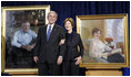 President George W. Bush and Mrs. Laura Bush stand in front of their portraits Friday, Dec. 19, 2008, after the unveiling at the Smithsonian's National Portrait Gallery in Washington, D.C. The portrait of Mrs. Bush was done by Aleksander Sasha Titovets; the Presidential portrait was done by Robert Anderson.