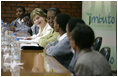 Mrs. Laura Bush joins Rwanda first lady Jeannette Kagame, center, as they listen to students during a forum Tuesday, Feb. 19, 2008 in Kigali, Rwanda, to promote girl's education.