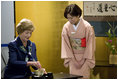 Mrs. Laura prepares a cup of tea during a ryureishiki Monday, July 7, 2008, in Toyako, Japan. Mrs. Bush was joined by other spouses of G-8 leaders during a traditional Japanese cultural program that included this version of the tea ceremony, where guests and host are seated in chairs instead of on their knees. Traced back to 1872, this particular version was created so that foreign guests at international expositions could more comfortably participate in the ceremonies.