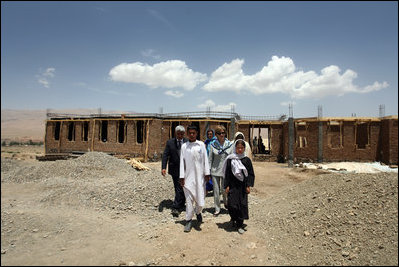 Mrs. Laura Bush is joined by Governor of Bam iran Province, Habiba Sarabi, right, and students, during a tour of the future site of the Ayenda Learning Center Sunday, June 8, 2008, in Bamiyan, Afghanistan.The tour was led by Ihsan Ullah Bayat, far left. Once completed, the Ayenda Learning Center will provide a safe and nurturing environment for 128 of Bamiyan most disadvantaged children to live. At the same time, it will provide educational opportunities for as many as 210 children in the region.