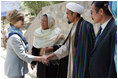 Mrs. Laura Bush meets with local leaders as she arrives June 9, 2008 at the Bamiyan Bazaar in Afghanistan to inaugurate work on the road project.