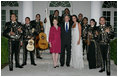 President George W. Bush and Laura Bush pose for photos with singer Shaila Durcal, Dorio Ferreira Sanchez and the Mariachi Campanas de America following their performance in the Rose Garden Monday evening, May 5, 2008, during a social dinner at the White House in honor of Cinco de Mayo.