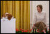 Mrs. Laura Bush smiles as the Westminster Kennel Club's 2008 Best in Show winner, Uno, is introduced to invited guests Monday, May 5, 2008, in the East Room during the beagle's visit to the White House Monday, May 5, 2008.