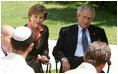 President George W. Bush and Mrs. Laura Bush listen to as a young participant during a roundtable discussion Friday, May 16, 2008, at the Bible Lands Museum Jerusalem. On the topic of peace with the Palestinians, the young student said, "I’m religious, but I want to give the Arabs land,’’ he said. "I feel I have a good life. Why don’t they get a good life too?"