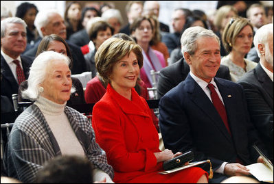 President George W. Bush and Mrs. Laura Bush smile as they participate Wednesday, Nov. 19, 2008, in the reopening of the National Museum of American History in Washington, D.C.